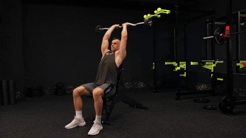 Як виконувати розгинання трицепса сидячи над головою з EZ-штангою?