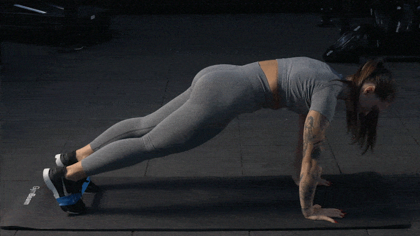 Коліно до ліктя у планці з еспандером - вправа