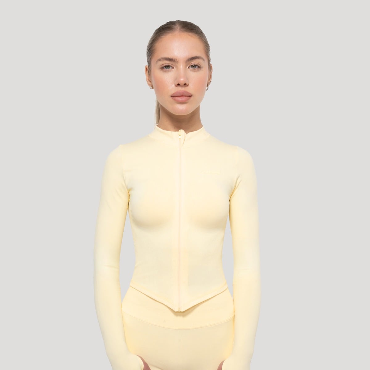 Жіночий спортивний топ Luma вершково-жовтий - GymBeam
